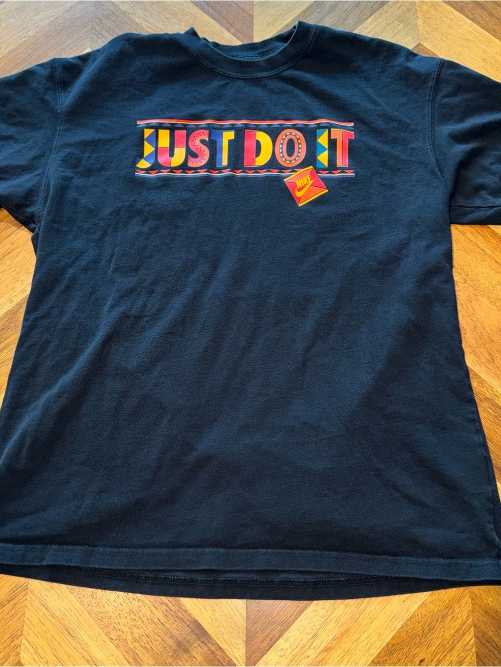 Nike Black Short Sleeve Tee with Colorful 'Just Do It' Graphic